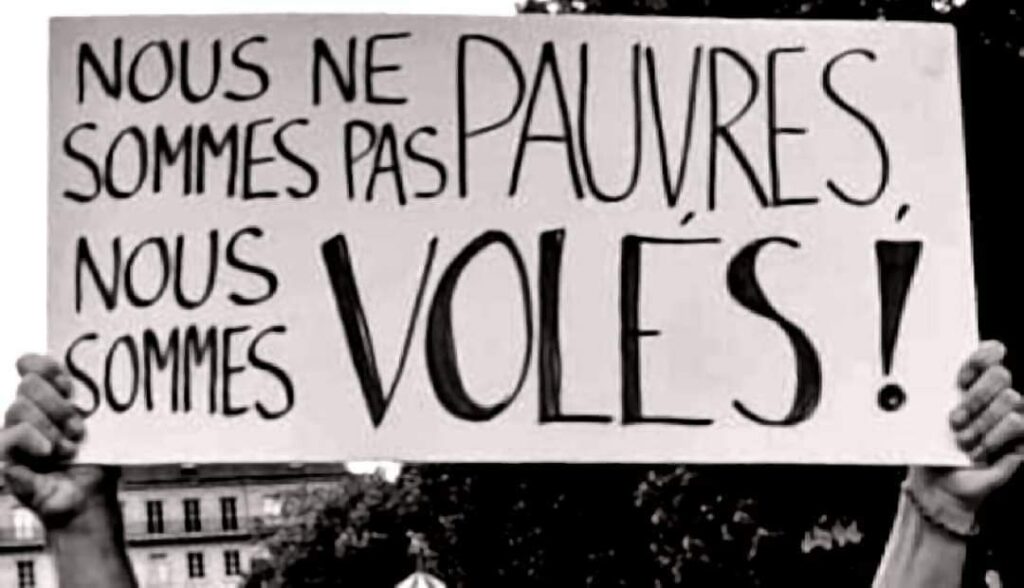 Pancarte manif : "Nous ne sommes pas pauvres, nous sommes volés !"